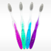 Nano Silver Care Toothbrush Bulk toothbrush with silver infused feathers bristles in four colors teal blue purple and magenta